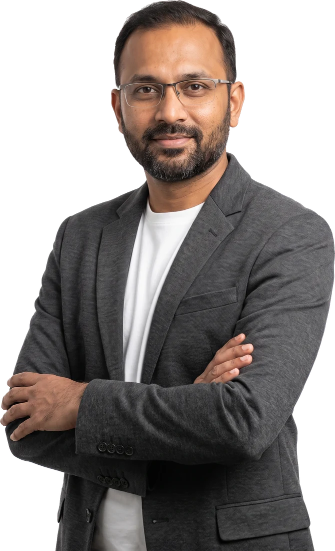 An agency owner, arms crossed, calm expression